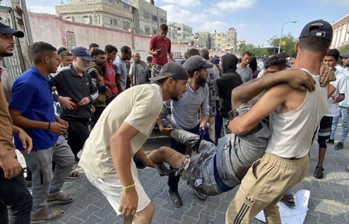 Palestinians transport an injured man to Nasser Medical Complex in southern Gaza after the Palestinian Ministry of Health said that over 50 people had been killed while seeking aid in Khan Younis on Tuesday.